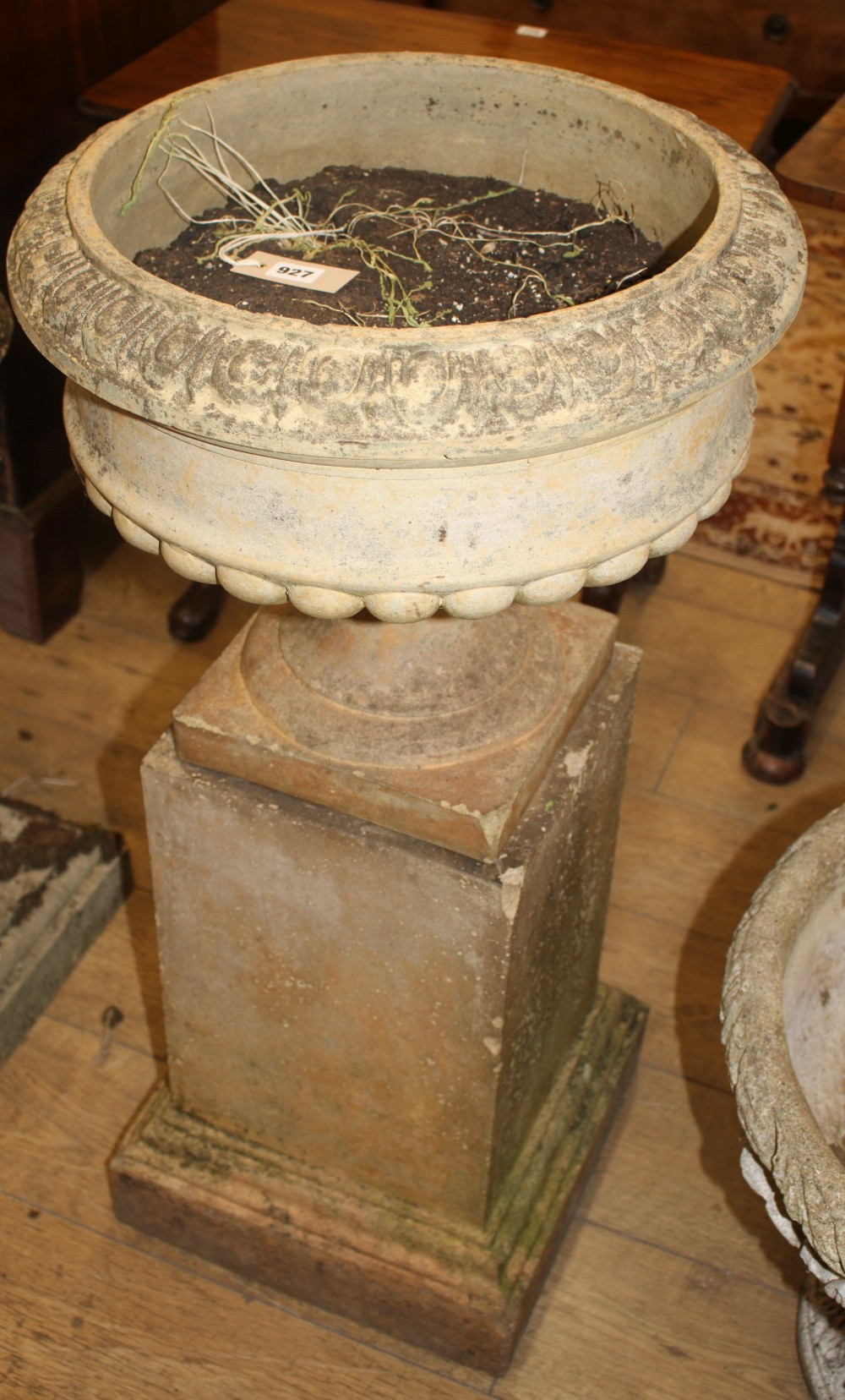 An early 20th century terracotta garden urn on square pedestal, H.96cm Diam.48cm